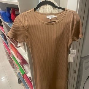 MIDI dress semi body fit, but an A line style towards the bottom.